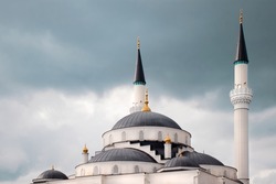a beautiful mosque in a dark cloudy weather
