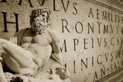 Bernini statue detail of Gange with Latin words engraved on a wall Roman Capitol