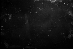 Black scratched grunge background, dusty scary horror texture, old film effect, space for your design