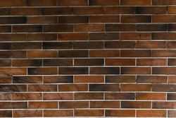 Abstract brick pattern design of an exterior wall. Color variety of a stonework