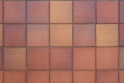 Clay Tile Flooring texture. Clay tiles. Red stone clay quarry tiled floor detail. Aged tiles square clay orange floor. tiled floor with Terracotta tiles