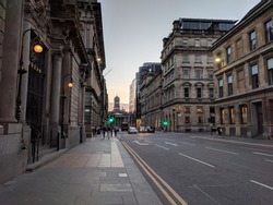 City view and George Square at the end of the street in Glasgow, Scotland