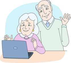 Senior couple using computer at home