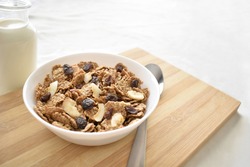 Fruit and fiber cereal on a bowl. The concept of healthy breakfast, healthy food, dietary plan and weight loss program. Selective focus. Copy space is on the right side.