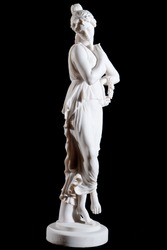 White classical marble statue of a woman with circlet of flowers isolated on black