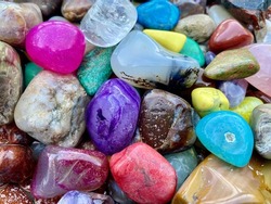 A close up of colorful polished rocks.