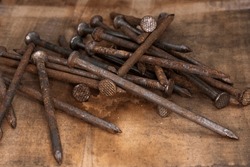 old rusty, 16 penny nails, pile of heavy penny nails for construction and carpentry, building, creating, antique, old, grandfathers building tools