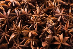Anise star seeds, aromatic Asian spices ingredient in cooking, star anise background.