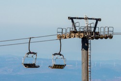 Cableway in mountains for skiers in ski resort