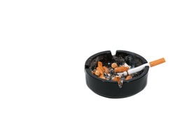 Dirty black ceramic ashtray full of smoked cigarettes Isolated on a white background.