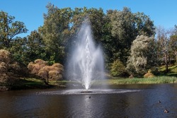Picturesque landscape with a bright fountain on the water. Madona. Latvia.