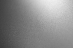Gray metal background, gradient from white to black .