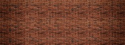 Red brick wall. Texture of old dark brown and red brick wall panoramic backgorund.