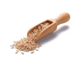 Unpolished wild brown rice rice in a wooden scoop and in a bowl isolated on white background