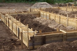 Wooden formwork concrete strip foundation for a cottage