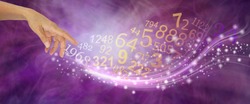 Numerology is far more than just NUMBERS - female hand appearing to create a swish of sparkles and a flow of random numbers on a pink purple energy formation background