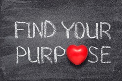 find your purpose phrase handwritten on chalkboard with red heart symbol instead of O
