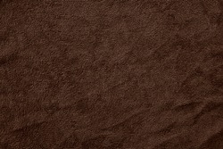 Texture of natural brown fabric or cloth. Fabric texture weave of natural cotton or linen textile material. brown canvas background. Decorative fabric for curtain, furniture, walls, clothes