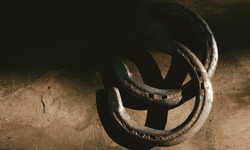 Horseshoes on old wood texture background with copy space for western equine industry.