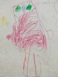 pictures of children on the wall. the boy draws a monster.
