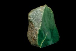Macro stone Nephrite mineral on black background close up