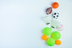 Ping pong ball, Football toy, Baseball toy, Shuttlecock,Tennis ball, Basketball toy and Rugby toy isolated on white background with copy space.Concept winner of the sport