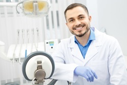 Portrait of an attractive male dentist sitting at his office copyspace profession occupation doctor medicine clinic help experience trustworthy specialist care health vitality dentistry dental oral