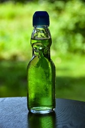 Melon soda in a nostalgic ramune bottle