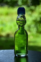 Melon soda in a nostalgic ramune bottle