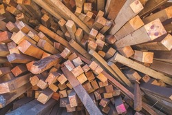 Stacks of multiple different lengths of timber ready for re-processing in the timber yard. timber offcuts.