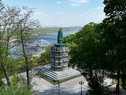View of the Monument to Prince Vladimir protected of the missile strike, Vladimir Hill park. Photo of the spring city of Kyiv - the capital of Ukraine during the war