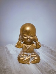 Kikazaru (聞か猿) A small Japanese Buddhist figure that represents Kikazaru covering his ears avoiding listening to negative messages that others want to convey to us