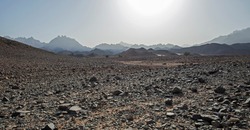 Landscape scenic view of desolate barren rocky eastern desert in Egypt with mountains