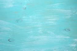 Turquoise painted wood background.