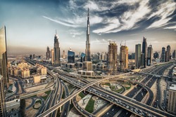 HDR photo of Dubai skyline with beautiful city close to it's busiest highway on traffic