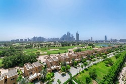 Panorama of the golf course with Dubai skyline on the background 