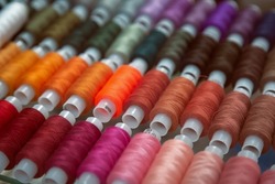 Multi-colored spools of thread close-up