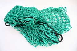 Trailer safety net polyethylene on white background isolated. Object helping Trailer and luggage net load protection; in green colour. Security and protecting for transport concept.