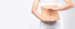 Close up woman hands made protect shape stomach isolated on white background banner size.health care digesting concept.