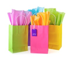 Colorful bags with paper and tag