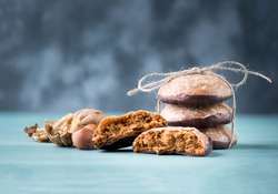 Nuremberg gingerbread with nuts on a blue and grey background, empty space for text, german sweetness for christmas