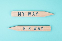 The words my way his way are standing on wooden arrows, christian religion faith, trust and believe concept, religious pray