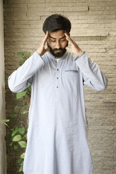 Pakistani man Headache wearing shalwar kameez, Desi man Headache, pakistani