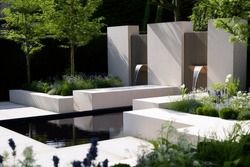 Avant-garde Garden Design with Geometry, Lush Vegetation and Stylized Water Fountain in Perfect Harmony