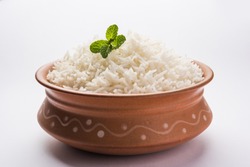 Cooked plain white basmati rice in terracotta bowl over plain or wooden background
