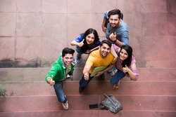 Top view of Cheerful Indian asian young group of college students or friends together standing in campus