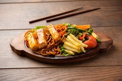 Paneer Sizzler is an Indian version with cottage cheese, salad served sizzling on hot stone dish.