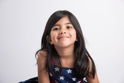 Indian girl posing for photo shoot with joyful and different expressions, isolated over white background