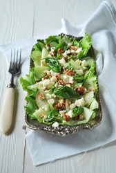 Green salad with cucumber, pear, feta, walnuts