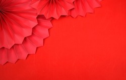 Lucky Chinese new year red background decoration with paper fan